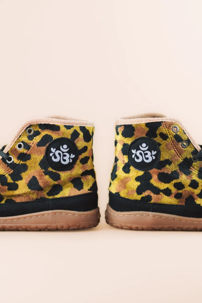 Pair of CHEETAH barefoot ankle boots seen from behind, with the Sambas logo on the heel
